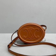 凯旋门2025新款猪鼻子圆饼包迷你时尚百搭单肩斜挎手提女包相机包