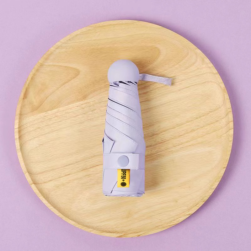 50% de descuento sol y lluvia paraguas de protección solar paraguas de sol UV portátil compacta cápsula sombrilla personalizada