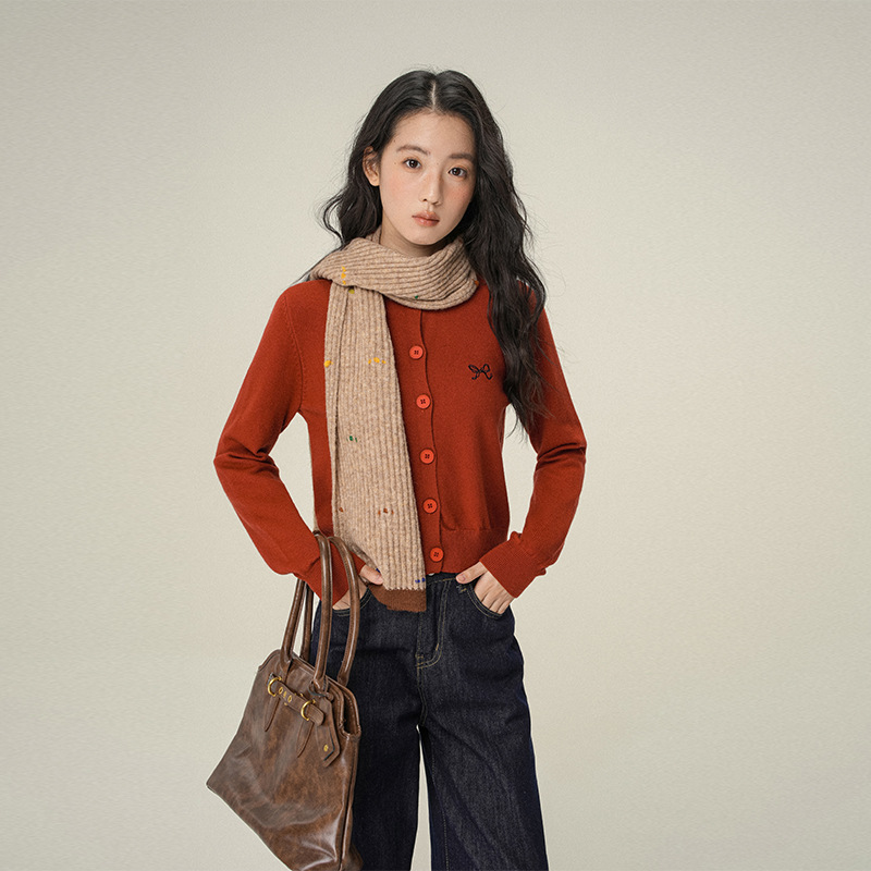 Red long-sleeve with a round collar with bow