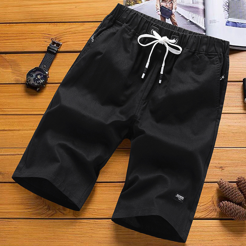 Pantalones de playa casuales para hombres, pantalones cortos de verano de cinco puntos, pantalones largos y sueltos para hombres, fábrica de siete puntos.
