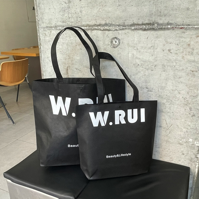 Bolsa de tela no tejida negra para imprimir logotipo de moda de la tienda de ropa de mujer bolsa de publicidad de compras