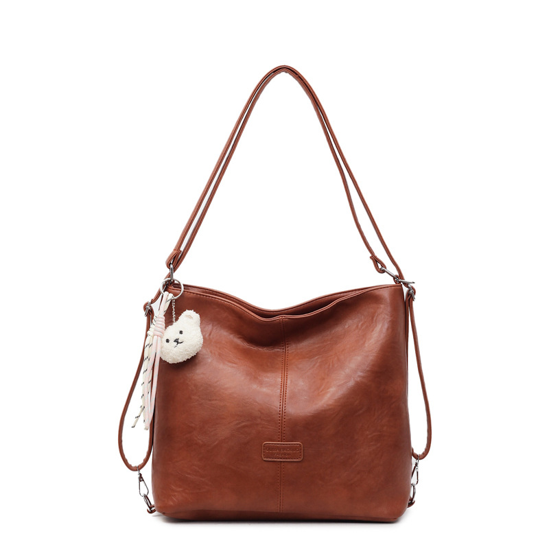 Bolsa de hombro retro transfronteriza de cuero suave de gran capacidad bolsa de cubo de agua para mujeres 2025 nueva simple mochila de viaje ocio