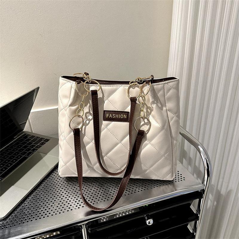 Bolso de gran capacidad de ocio para mujeres 2023 primavera nueva simple estilo extranjero de transporte de mochila de moda textura tote