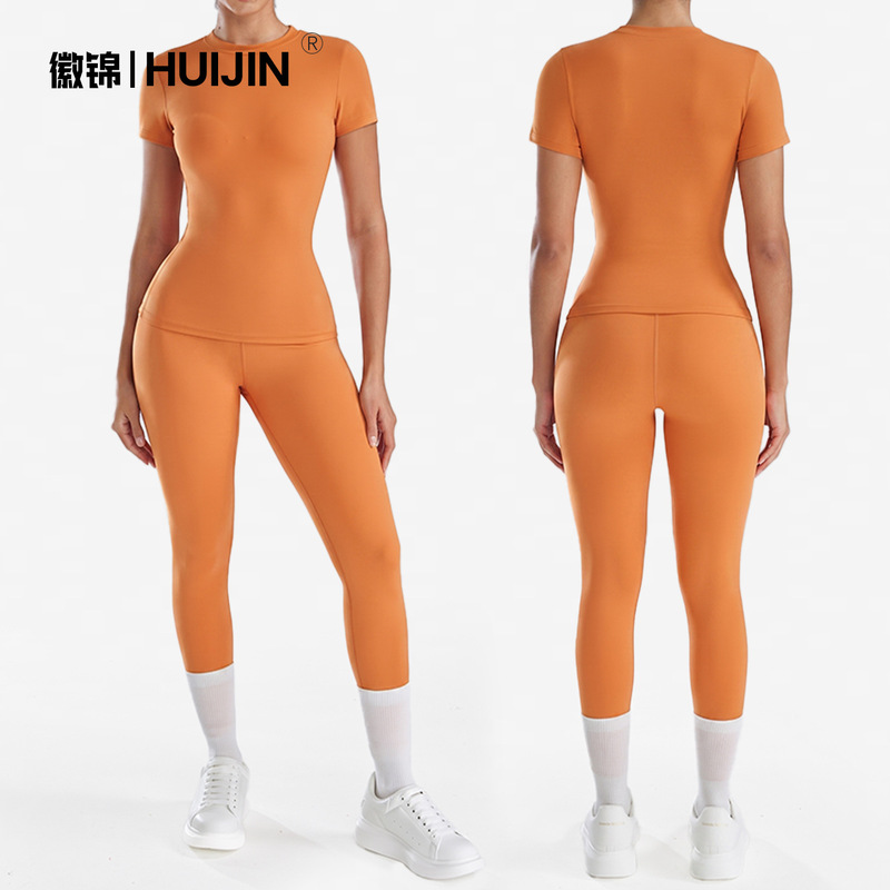 Cross-border bestseller: Nude-feel short-sleeve yoga two-piece set for women, round-neck tight pants, peach butt Pilates fitness outfit Cross-border bestseller: Nude-feel short-sleeve yoga two-piece set for women, round-neck tight pants, peach butt Pilates fitness outfit