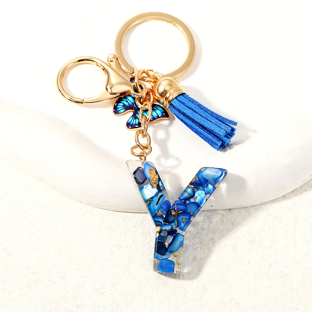 Nuevo transfronterizo mariposa 26 letras inglesas de cristal goteo llavero bolsos accesorios colgante de automóviles