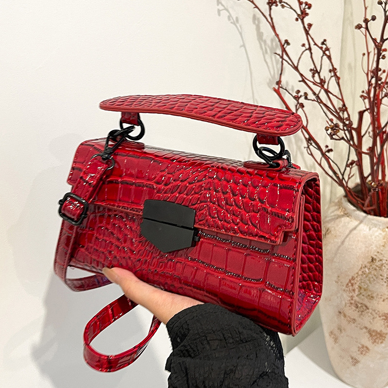 Bolso de textura transfronteriza 2025 verano nuevo estilo personalidad patrón de cocodrilo bolso de hombro bolso de mensajero retro de moda todo fósforo