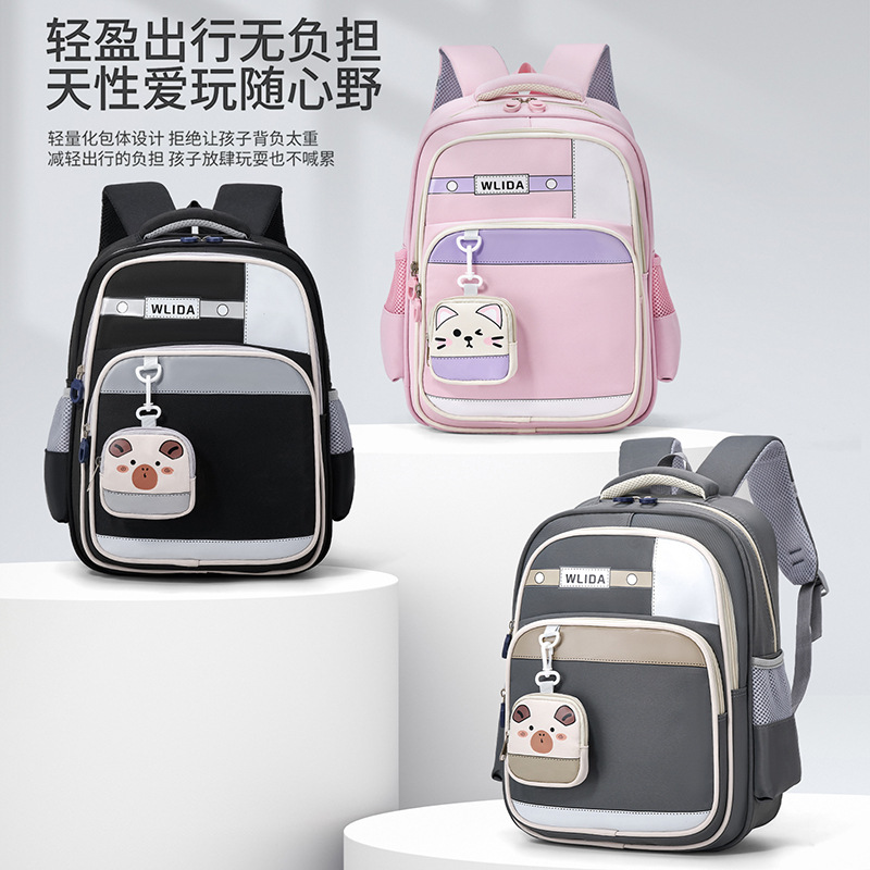 Mochila mayorista para estudiantes de primaria nueva mochila para niños y niñas de grado 1 - 3, mochila ligera para reducir la carga, mochila de ocio resistente al desgaste