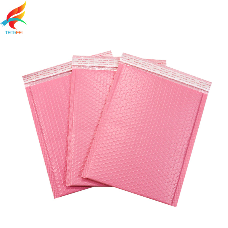 Bolsa de burbujas de película de coextrusión rosa al por mayor bolsa de espuma de sobre gruesa impermeable embalaje expreso bolsa autoadhesiva material de embalaje