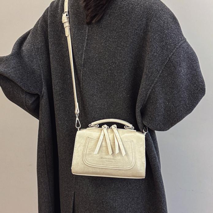 Bolso de mano de tendencia retro para mujeres 2025 nuevo diseño versátil bolso de almohada transfronterizo simple alta sensación mochila