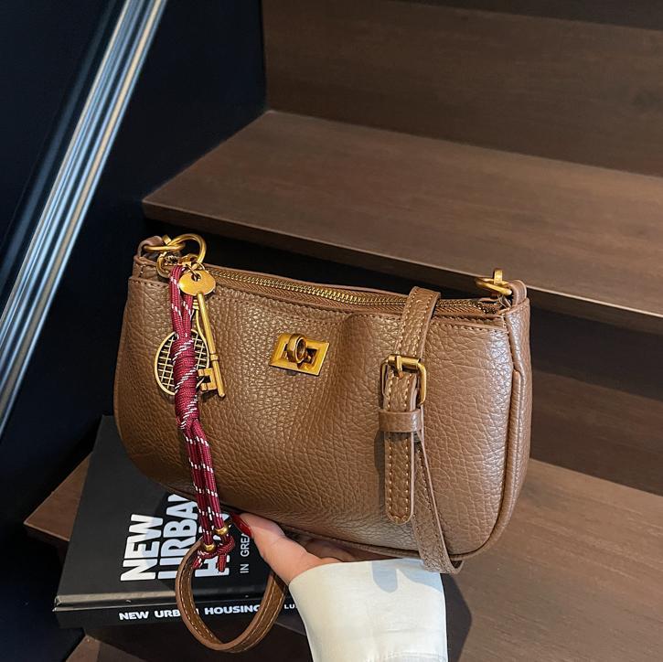 Bolso de explosión de comercio exterior para mujeres 2025 nuevo estilo universal retro de alta sensación bolso de hombro de moda universal bolso de hombro