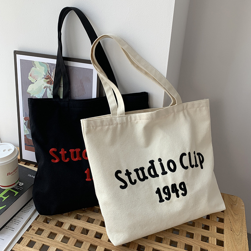 Estilo chino bordado bolsa de lona de los hombres femeninos de hombro nicho original simple letras artísticas de gran capacidad bolso de escuela del estudiante