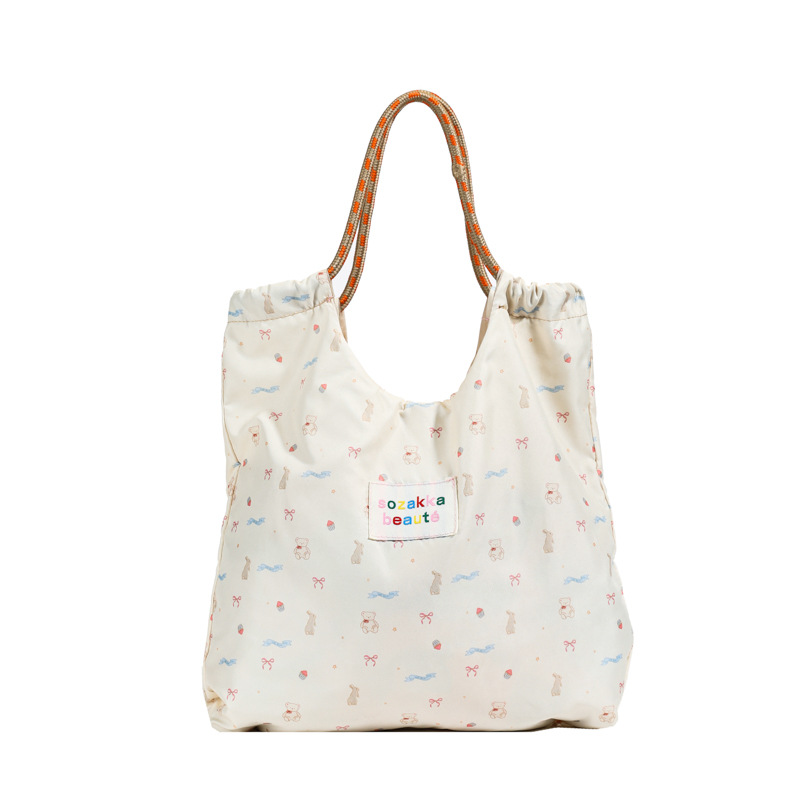 2025 bolsas casuales de alto valor, bolsas de mano, bolsas de regalo prácticas, cajas de regalos, bolsas de brazo de hombro de nicho de alto nivel, moda