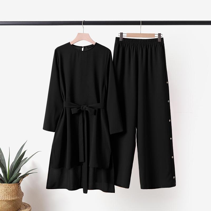 Women's everyday casual suit with a shorter front and longer back hem, elastic waistband, decorative buttons, and pockets - stylish and casual.
