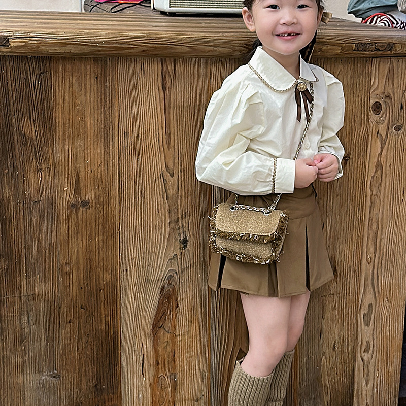 Bolso de hombro de moda para niños y niñas con bordes sin rebaby versión coreana de estilo occidental mini bolso de mensajero para bebés otoño e invierno nuevo bolso de cadena para niños