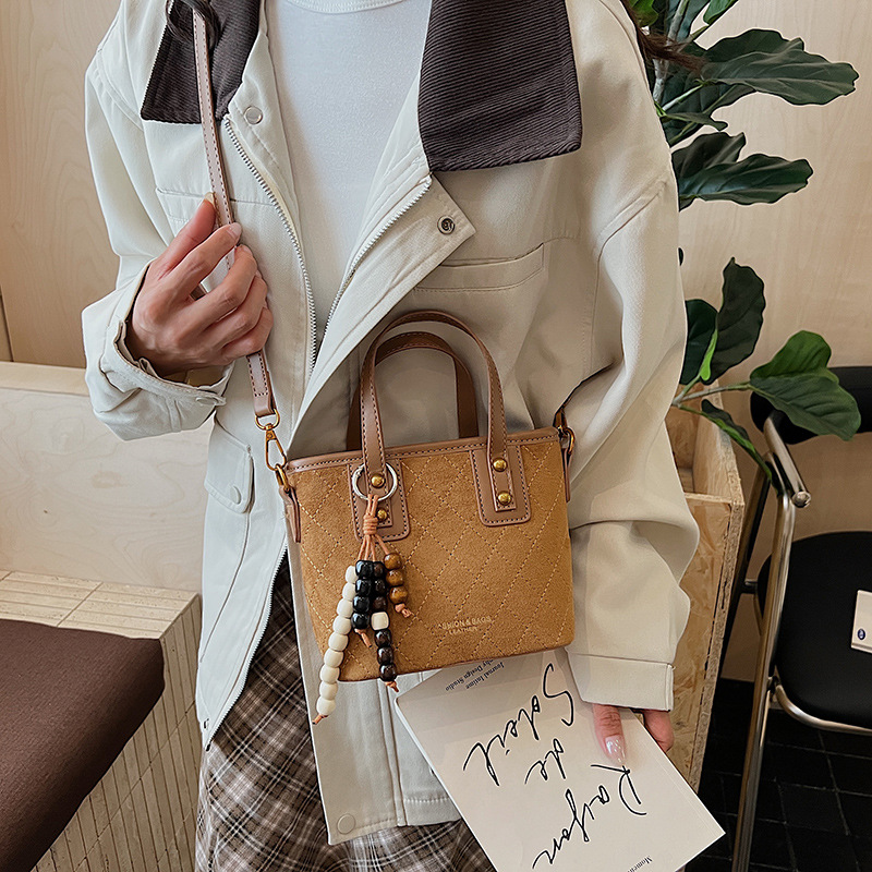 Nicho coreano Jeong seda bolso de balde de peluche mujeres otoño / invierno 2025 nuevo estilo versátil bolso de hombro bolso de alta calidad