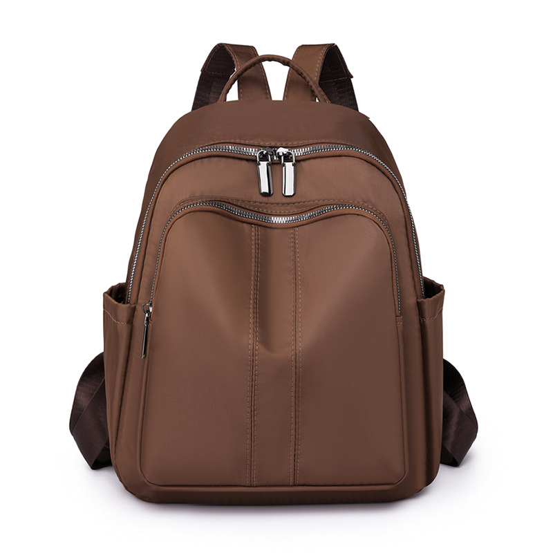 Spot al por mayor 2023 otoño nuevo estilo casual damas mochila de nailon al aire libre mochila de viaje ligera mochila escolar