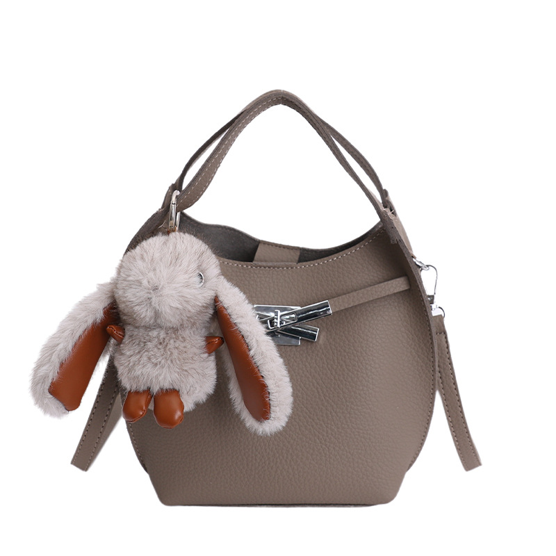Bolso de mujer nuevo estilo coreano nicho de moda lichi bolso de cubo portátil de alta sensación de ocio mochila de viaje