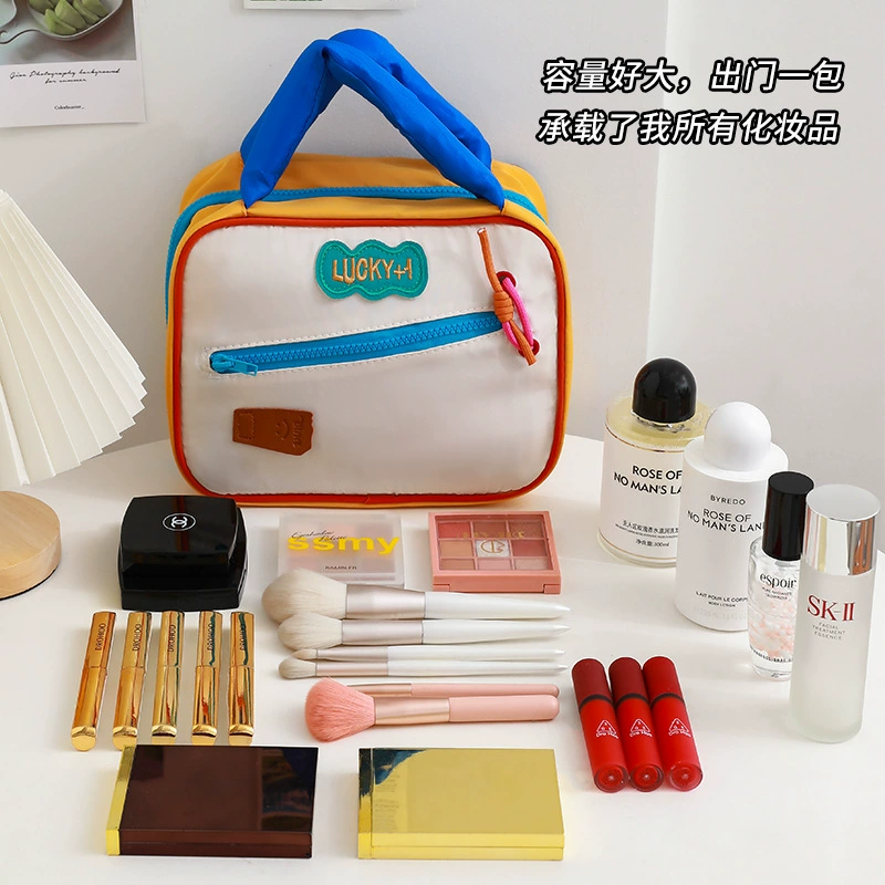 Cute capacious handheld folding cosmetic bag, organizer bag for traveling