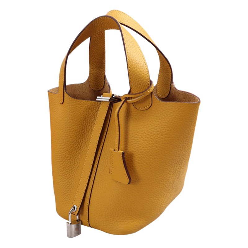 Una pieza de nueva bolsa de canasta de verduras a juego, bolsa de cubo de cuero, patrón de lichi, primera capa, bolso de mujer portátil de todo fósforo de piel de vaca