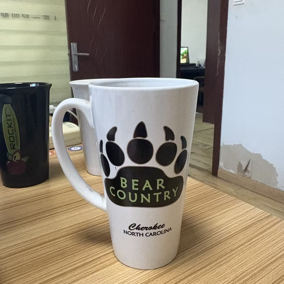 Fabricantes de tazas de cerámica personalizadas al por mayor suministro directo de comercio exterior 11oz impresión LOGO taza de sublimación de transferencia de calor hueso taza de agua de porcelana