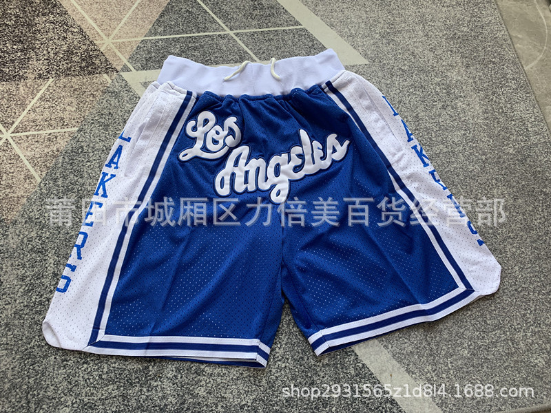 Comercio exterior pantalones de fútbol al por mayor Warriors Lakers 76 caliente Raptor mágico bolsillo bordado pantalones cortos pantalones de baloncesto NFL