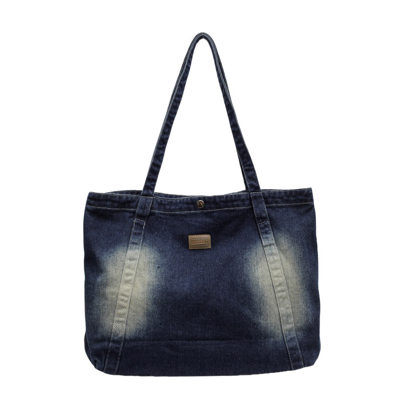 Diseño de nicho 2024 nueva versión coreana de mezclilla ins moda simple y versátil viaje de compras bolso de un solo hombro