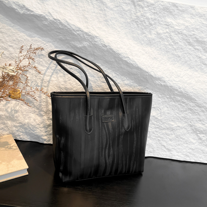 Bolso coreano nicho ZhongTote 2026 nuevo estilo de moda de mujer bolso de hombro de color sólido simple bolso de gran capacidad