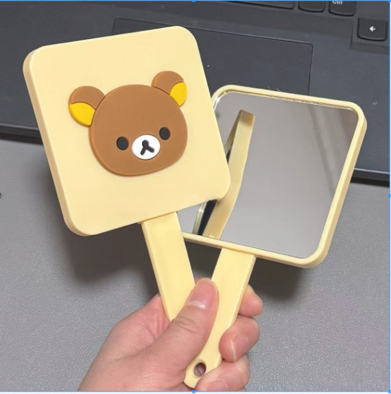 新しいかわいいリラックマの取っ手の鏡は櫛を持って携帯して化粧鏡の少女の心の鏡を持って一体の小さい鏡を結びます。|undefined