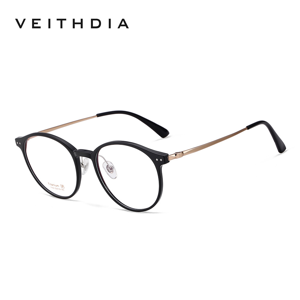 Pies redondos de titanio puro, marco de espejo de miopía óptica retro, marco de ojo masculino y femenino, puede estar equipado con grado al por mayor 7103