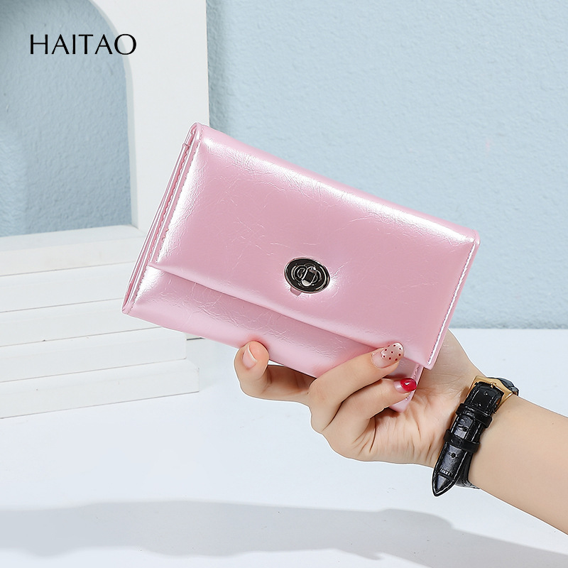 Nuevo tipo de billetera de mujer transfronteriza tres plegables cera de aceite billetera de cuero de gran capacidad multi-tarjeta de alta calidad billetera de cambio para mujeres