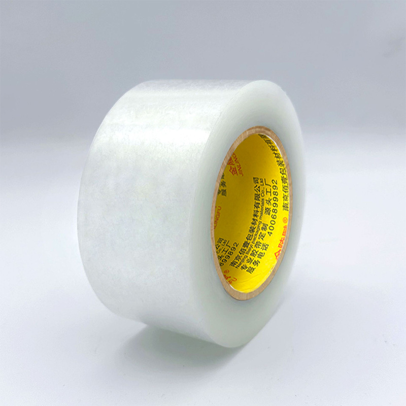 Mayorista caja de cinta adhesiva transparente alta tenacidad alta adhesiva empaque expreso papel de sellado amarillo caja de cinta adhesiva ancha tela de sellado de gran volumen