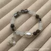 Black glass bracelet with bow, 8mm