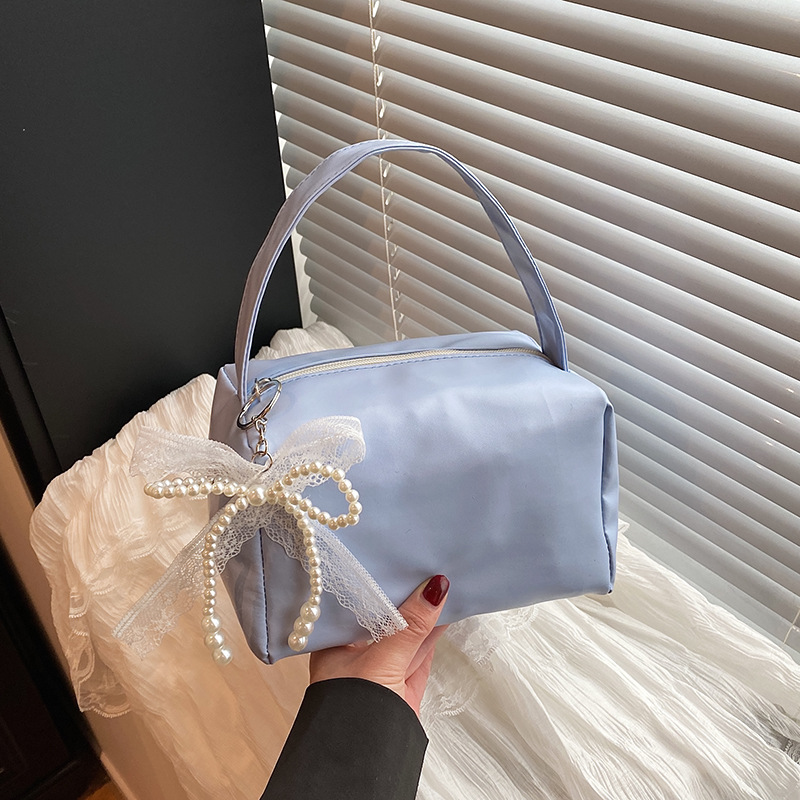 Bolsas de brazo populares de este año, bolsas de moda de moda coreana, bolsas pequeñas de primavera y verano 2025, bolsas de mujer casuales de nicho de moda.