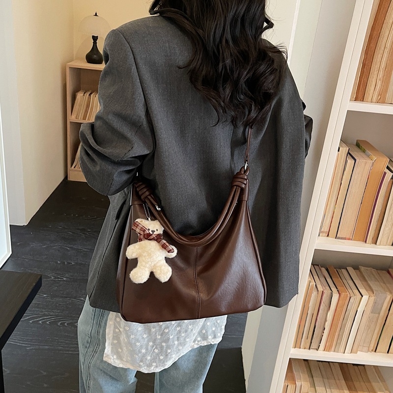 Bolsos de textura para mujeres 2026 nueva moda popular simple sensación cotidiana bolso de hombro de gran capacidad bolsa de viaje