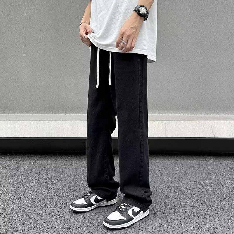 Vaqueros americanos, pantalones teñidos de barro amarillo de seda de hielo viejos lavados de verano para hombres, pantalones rectos sueltos de la marca de moda de la calle principal