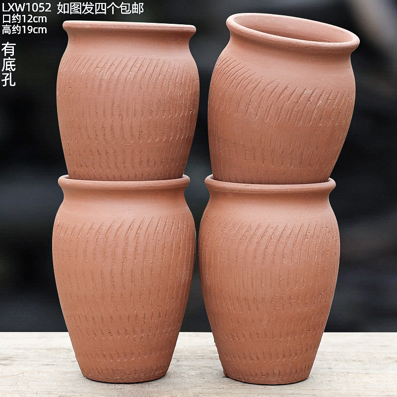 Cuatro latas altas de cerámica roja