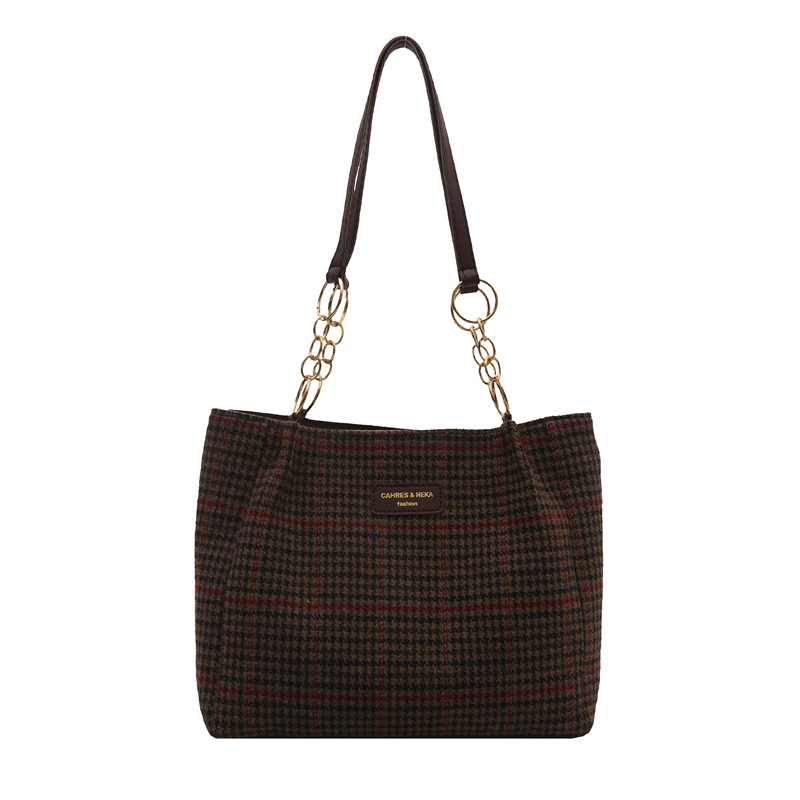 Bolso retro para mujeres 2025 primavera nueva celosía de gran capacidad relajada sensación de moda casual mochila de hombro