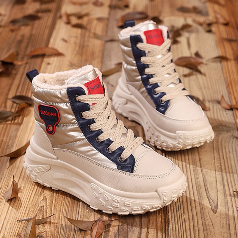 Botas de nieve de invierno de mujeres 2025, una nueva piel en una calentadora zapatillas deportivas cómodas y zapatos de algodón gruesos para mujeres