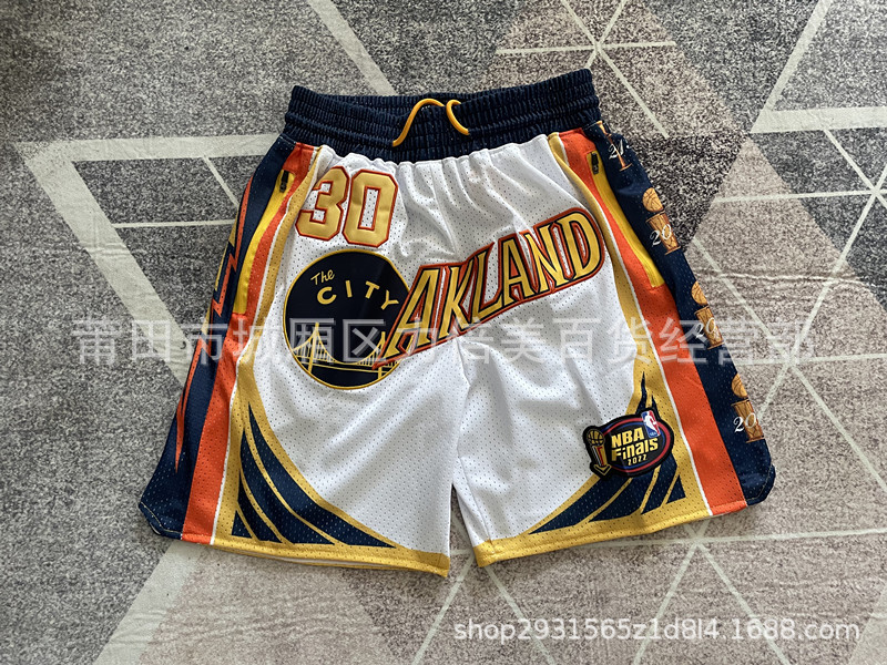 Comercio exterior pantalones de fútbol al por mayor Warriors Lakers 76 caliente Raptor mágico bolsillo bordado pantalones cortos pantalones de baloncesto NFL