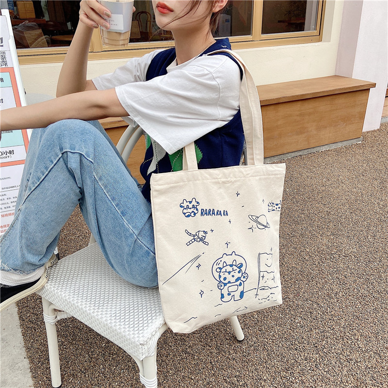 【 In Stock 】13173 Cute Moon Landing Cow single-shoulder Bag, student girls' schoolbag, canvas bag, large capacity wholesale undefined