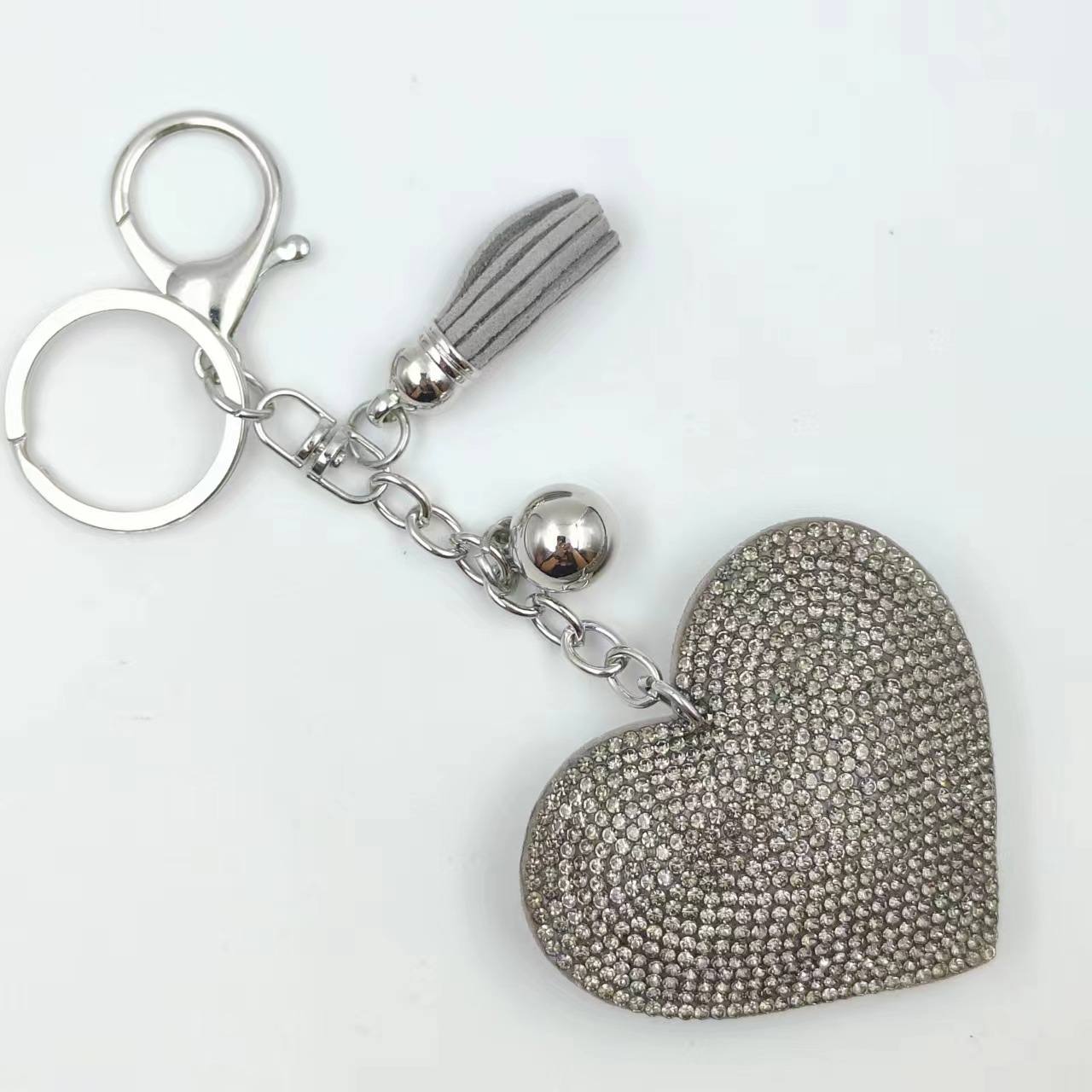 Estilo explosivo transfronterizo pequeño corazón de melocotón fragante llavero de cuero de diamantes calientes amor borla bolso colgante franela llave de diamantes