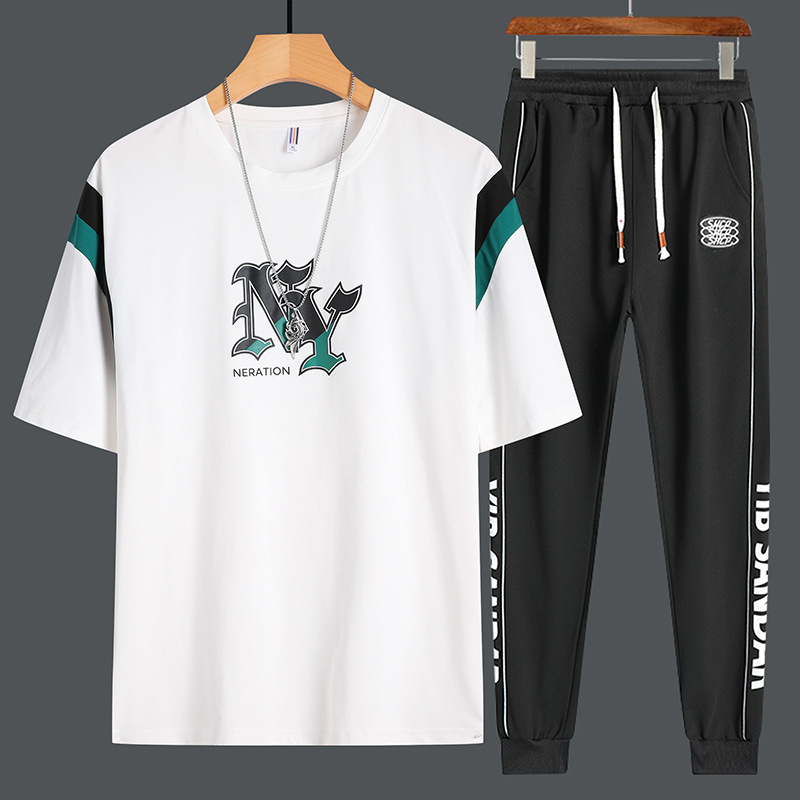 Set de mangas cortas para hombres de verano nuevo estilo de moda adolescente camiseta suelta con pantalones deportivos de tendencia casual de dos piezas