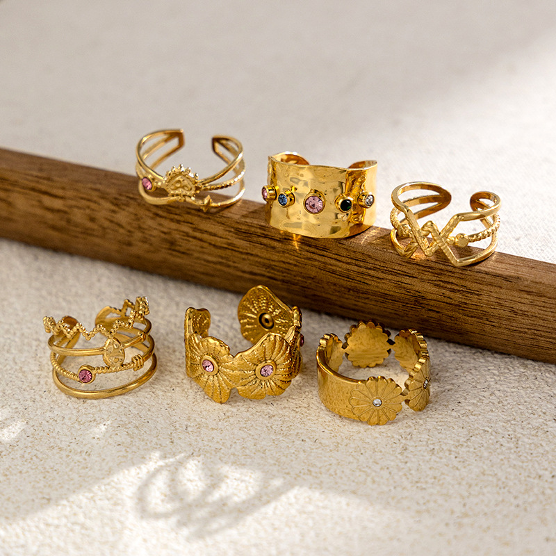 TENA oro de 18k acero inoxidable hueco anillo de zircón de alta calidad anillo de titanio diseñado por mujeres de nicho en el viento