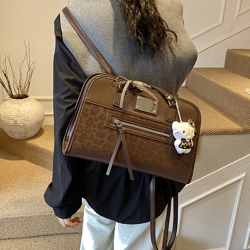 Retro leopardo hombro bajo la braza, la versión coreana de la mochila casual Zhongqi 2025 nuevo bolso de mano