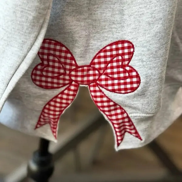 Popular custom-made Tennessee Volunteers women's team spirit sweatshirt with appliqué embroidery and side bow tie pullover style Popular custom-made Tennessee Volunteers women's team spirit sweatshirt with appliqué embroidery and side bow tie pullover style