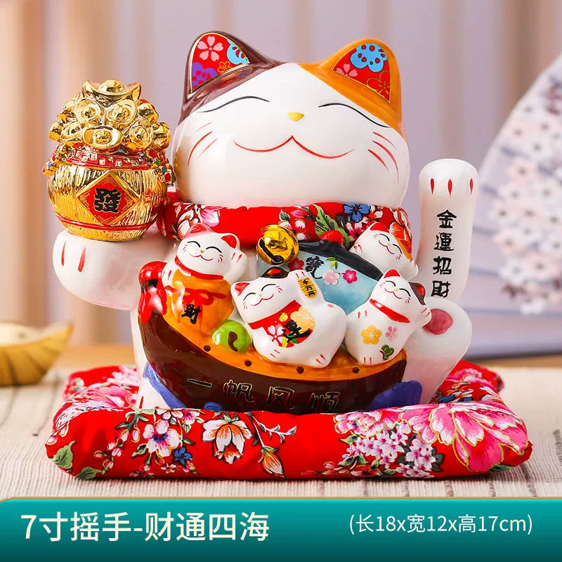7 -inch wealth cat ornament shakes hands.