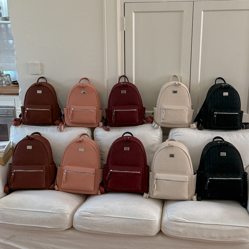 Mochila de moda coreana en relieve para mujeres simple color sólido mochila de viaje de gran capacidad 2026 nueva bolsa de mujer transfronteriza