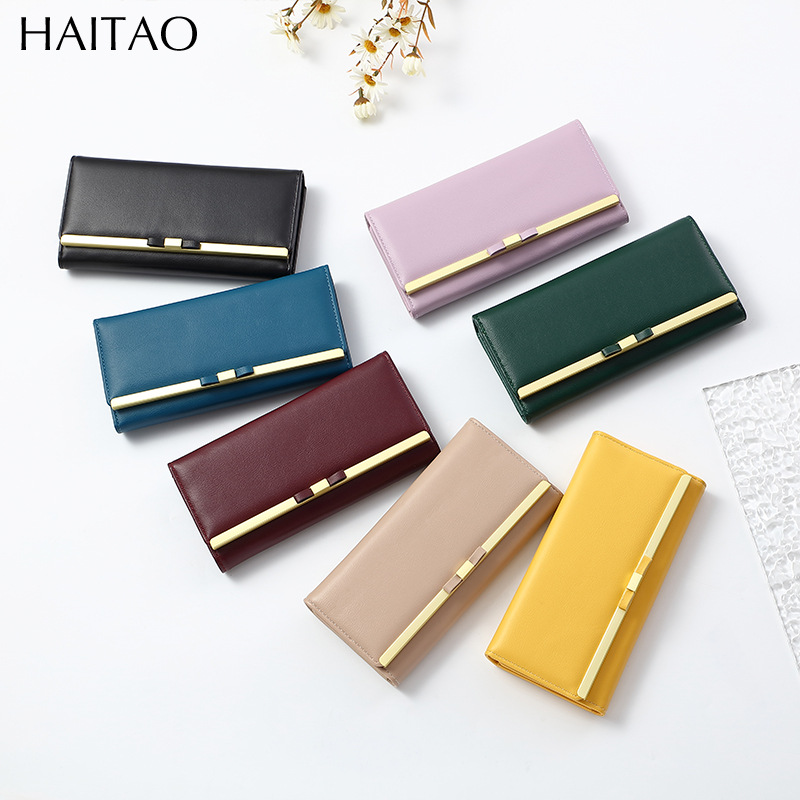 Nueva cartera larga para mujer, bolso de mano tipo clutch de color sólido de alta gama, cartera de cuero genuino al por mayor.