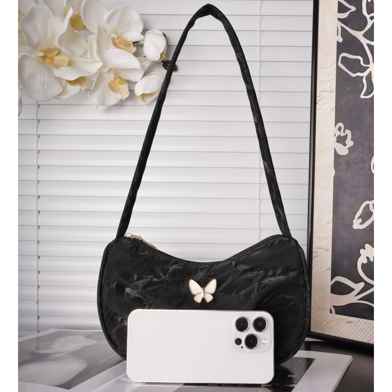 Bolsa de mariposa para mujeres 2025 verano nuevo estilo diario simple con casualidad de color sólido de hombro plegado en la parte inferior de la camisa