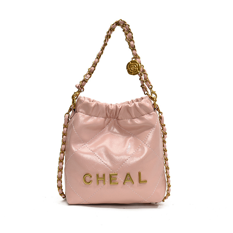 Bolsas de hombro de moda coreana para niños y niñas letras de aire extranjero bolsas de basura de color sólido rango 2025 nuevas bolsas de cadenas para niños